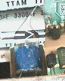 Photo of glue, holding new module to a nearby capacitor.